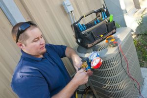 air-conditioning-maintenance-technician-checks-mainfold