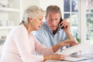 older-couple-on-phone