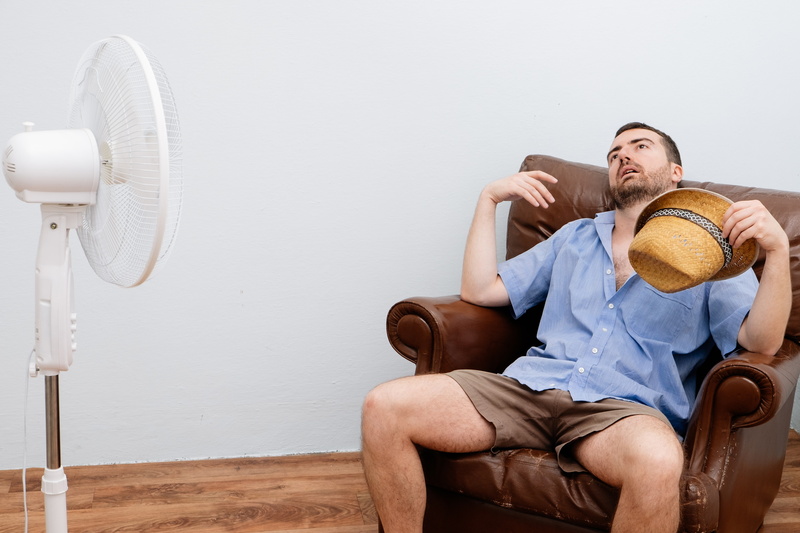 man-in-front-of-fan-on-a-hot-day