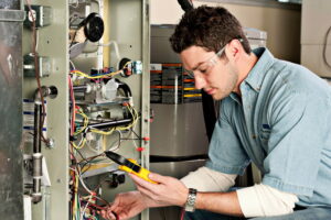 Service-technician-testing-furnace